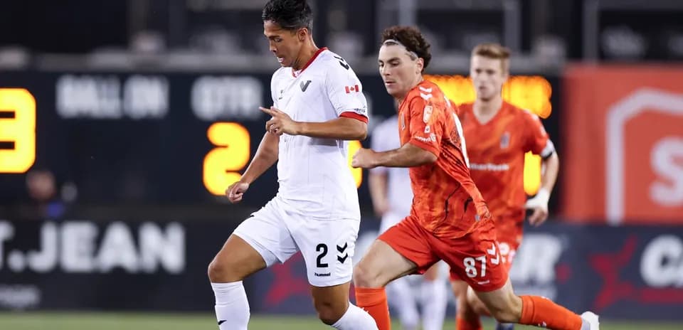 Player running with ball during match action