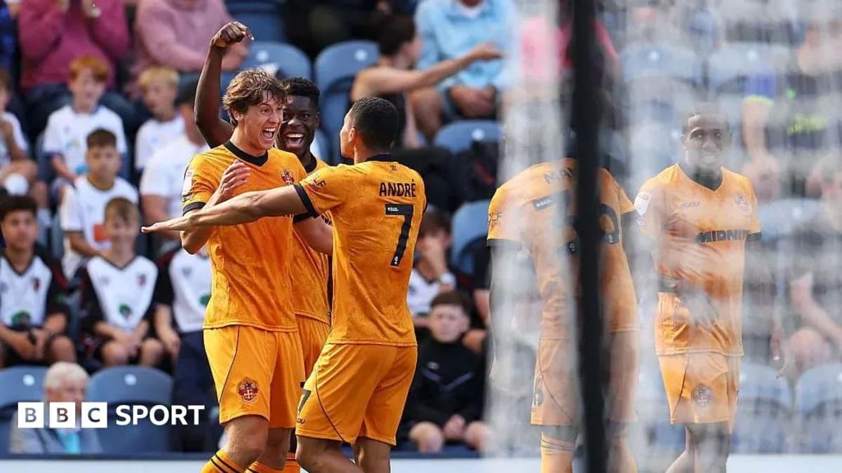 Players celebrating a goal during a match