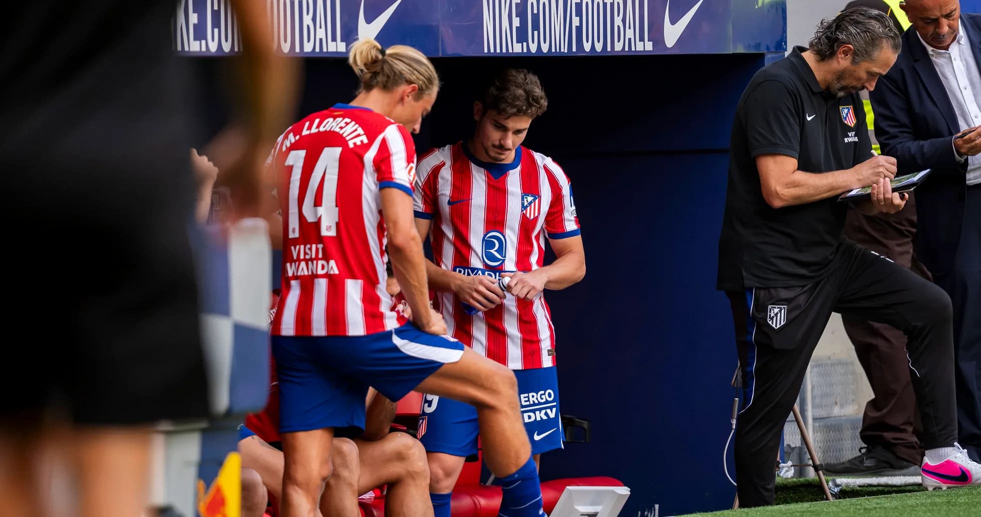 Atletico Madrid players on bench during match