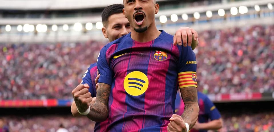 Barcelona player celebrating in front of crowd