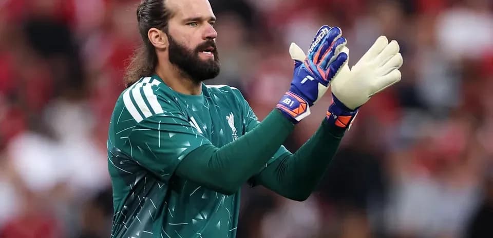 Goalkeeper wearing gloves during match preparation