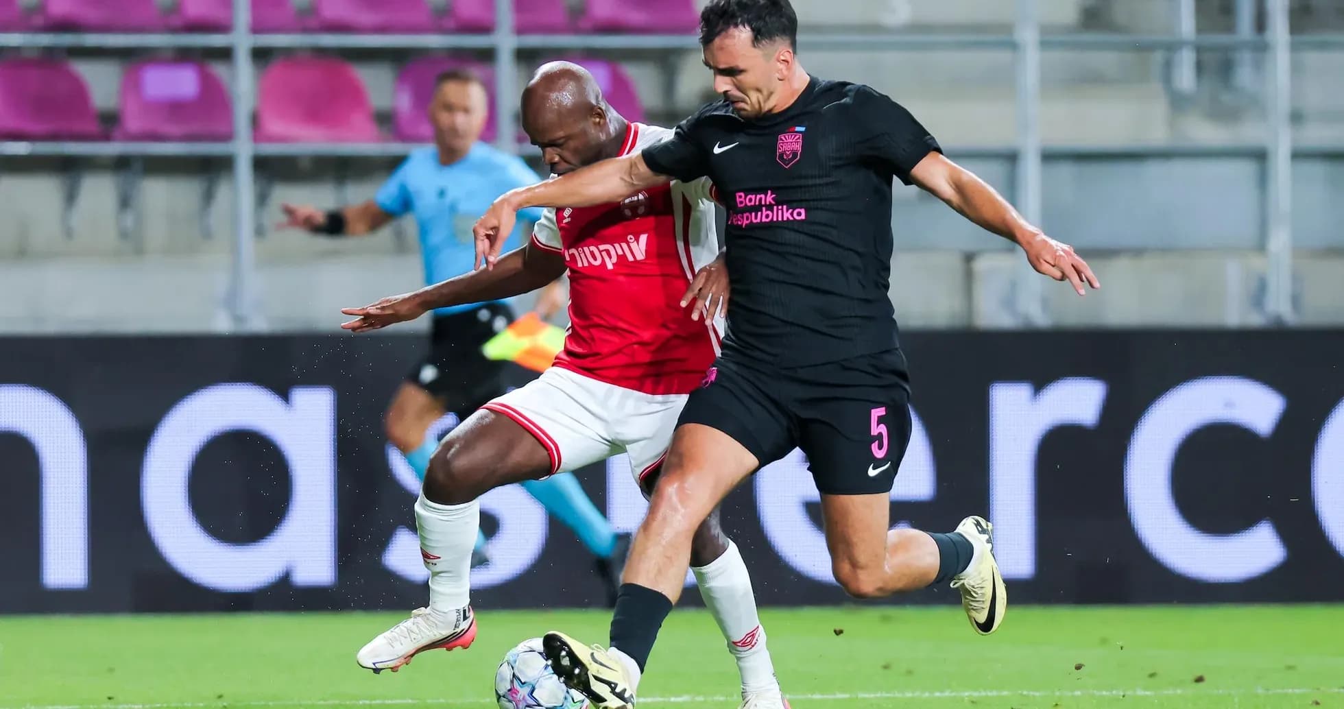 Players competing for the ball during match
