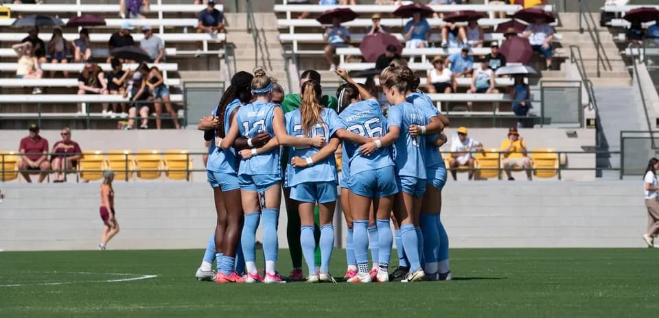 Team huddling together before a match