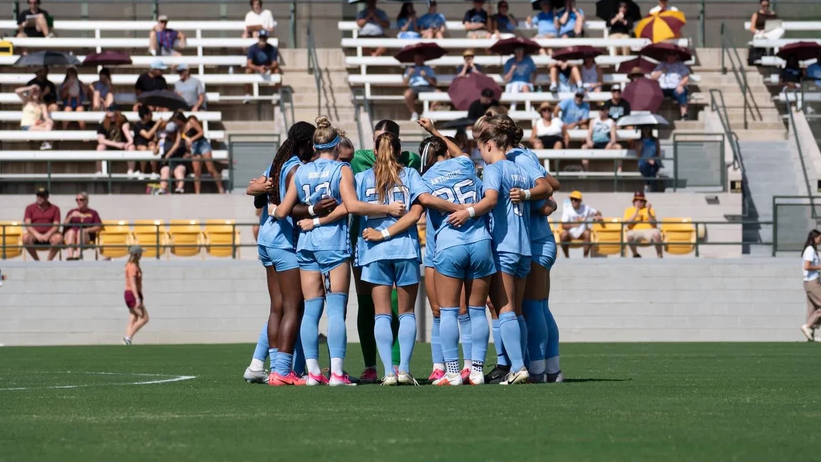 Team huddling together before a match