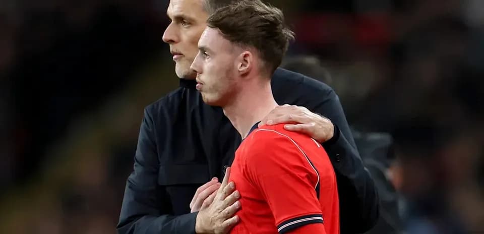 Coach talking to player during match substitution