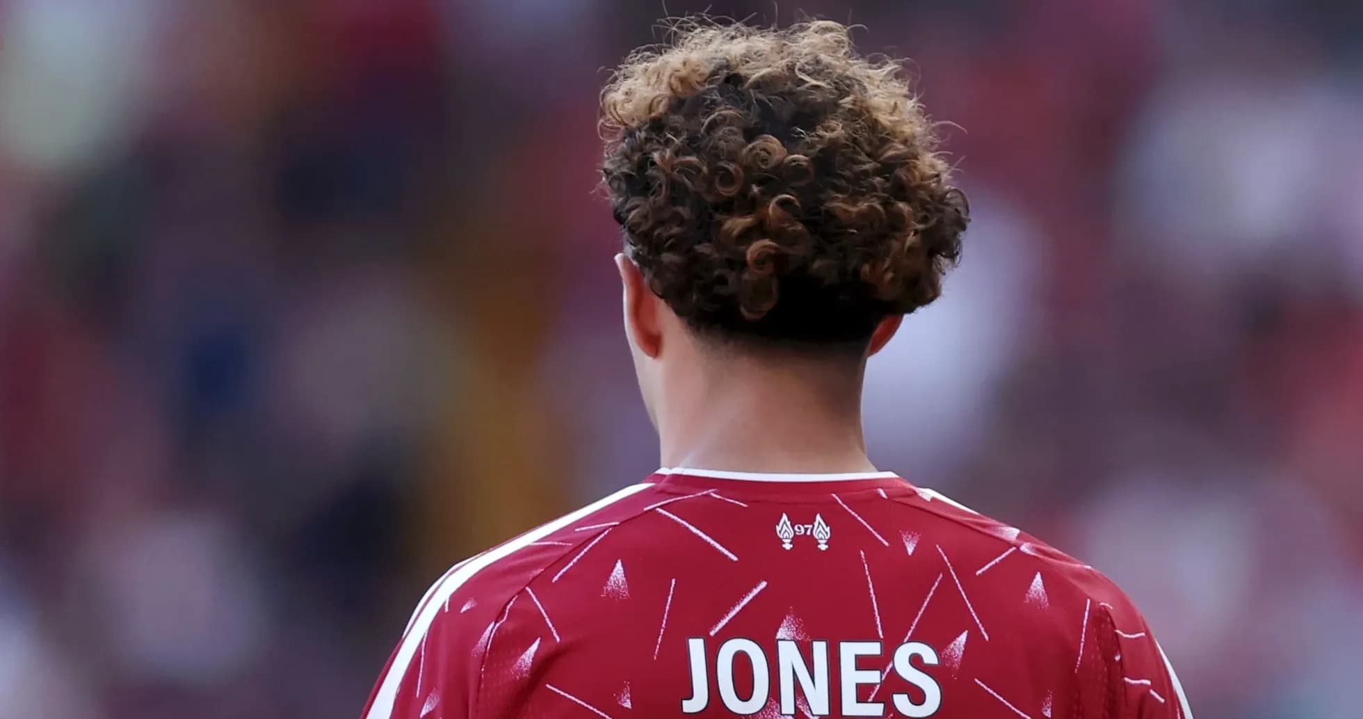 Player wearing red jersey with 'JONES' on back
