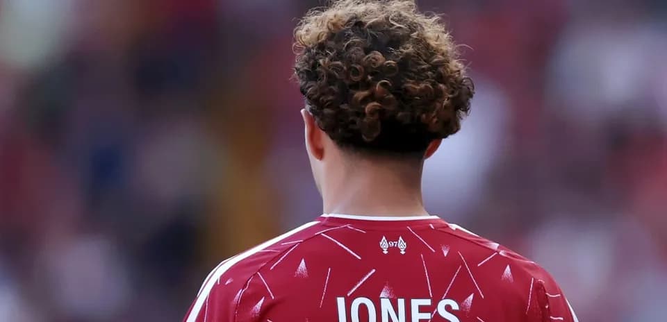 Player wearing red jersey with 'JONES' on back