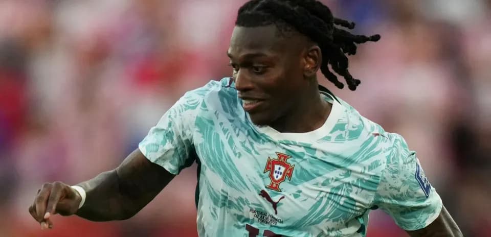 Player in Portugal kit running during match
