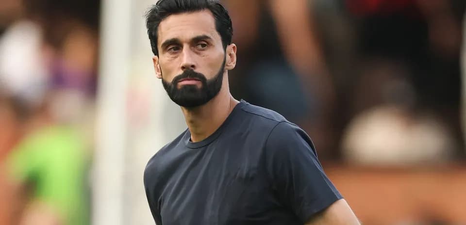 Man in black shirt observing the field