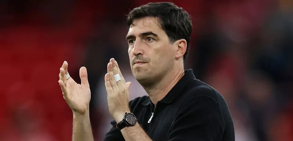 Coach applauding fans after the match