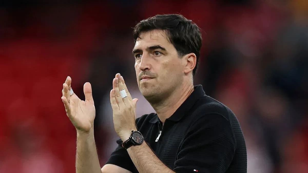 Coach applauding fans after the match