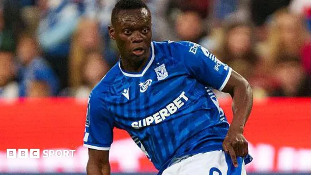Player in blue jersey dribbling during match
