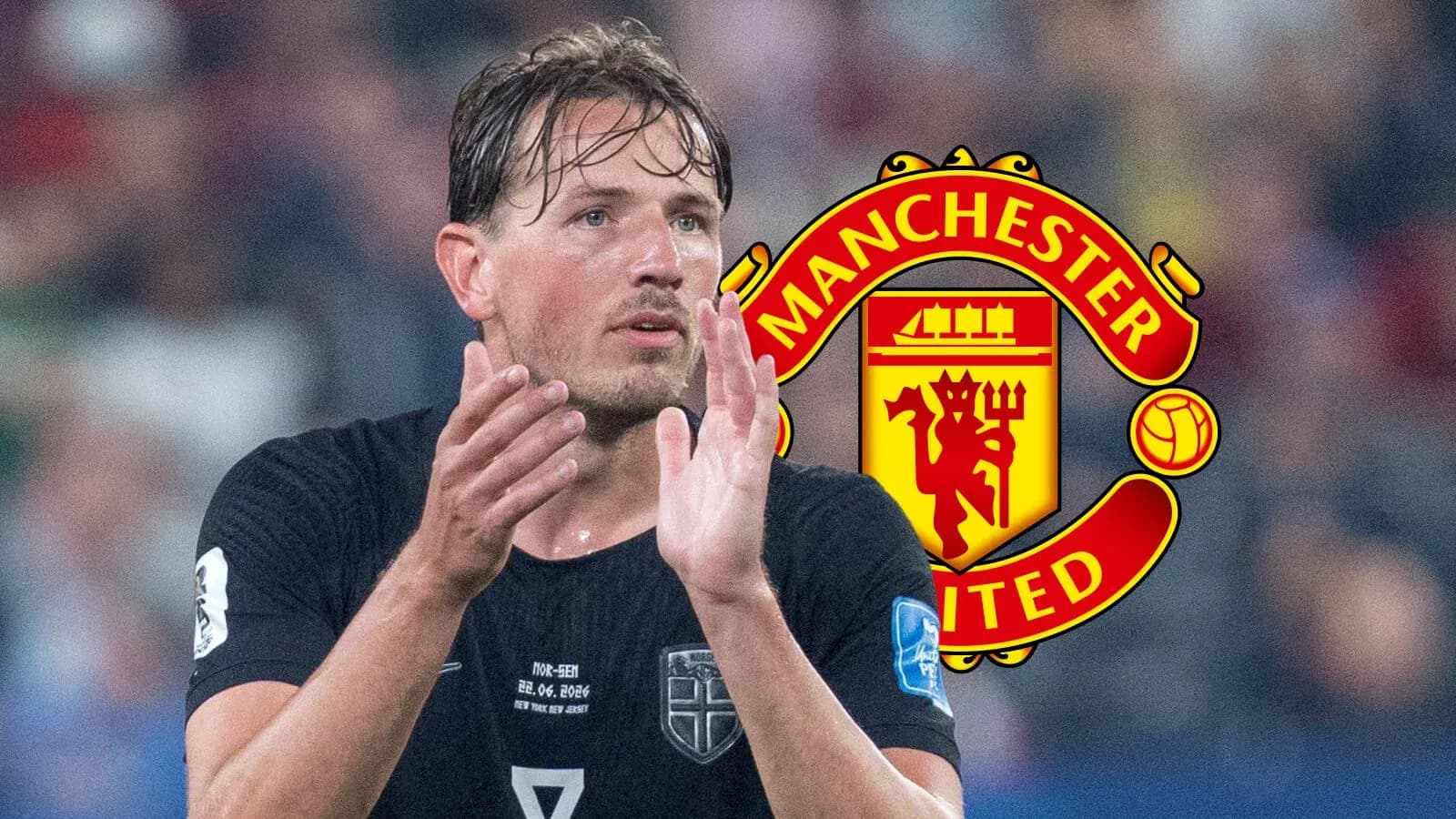 Player applauding with Manchester United logo in background