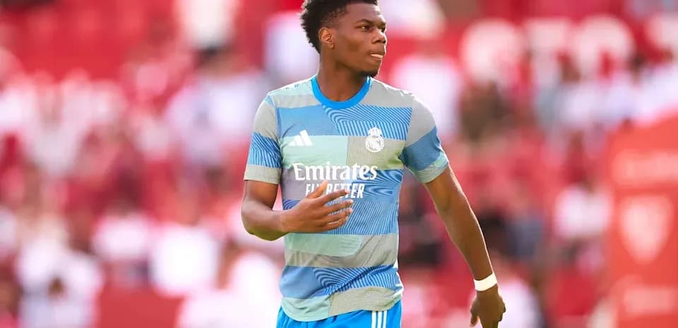 Player walking on pitch in Real Madrid training kit