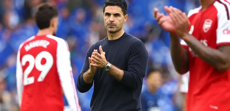 Manager applauding players during post-match interaction