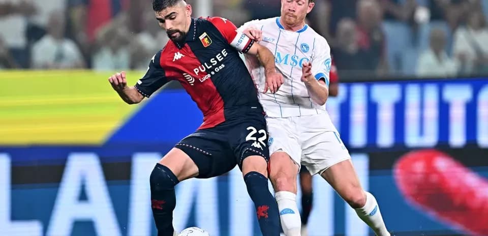 Two players contesting the ball during a match
