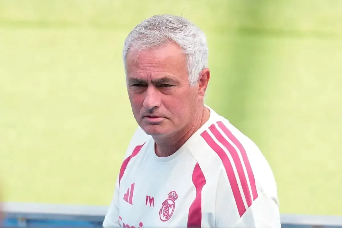 Football coach observing training session on field