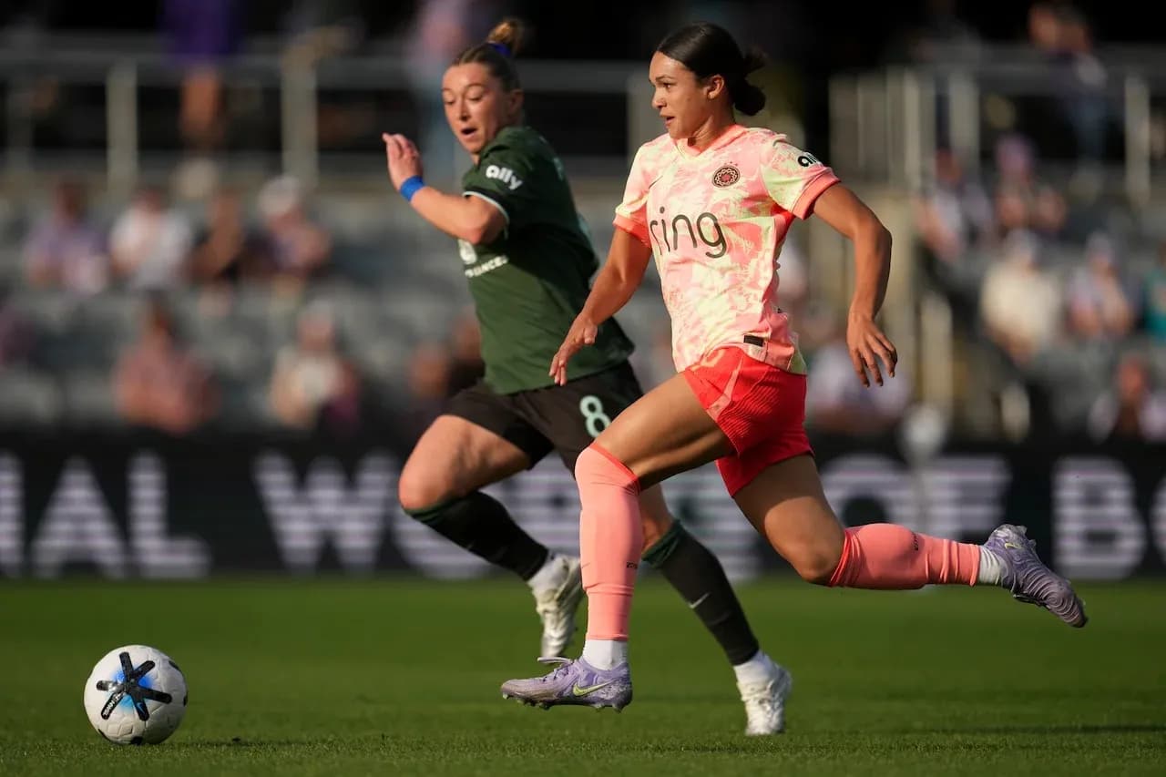 Two players competing for the ball in match