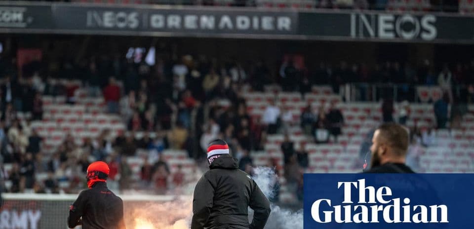 Fans igniting flares during a football match