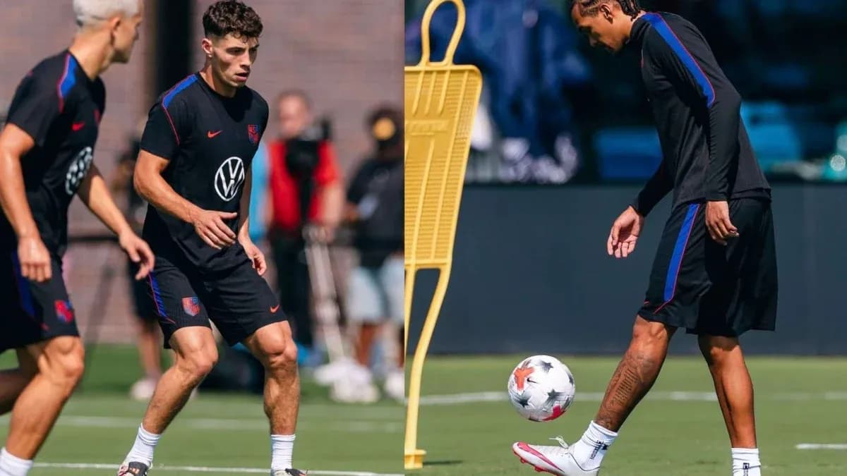 Two players training on the field with a ball