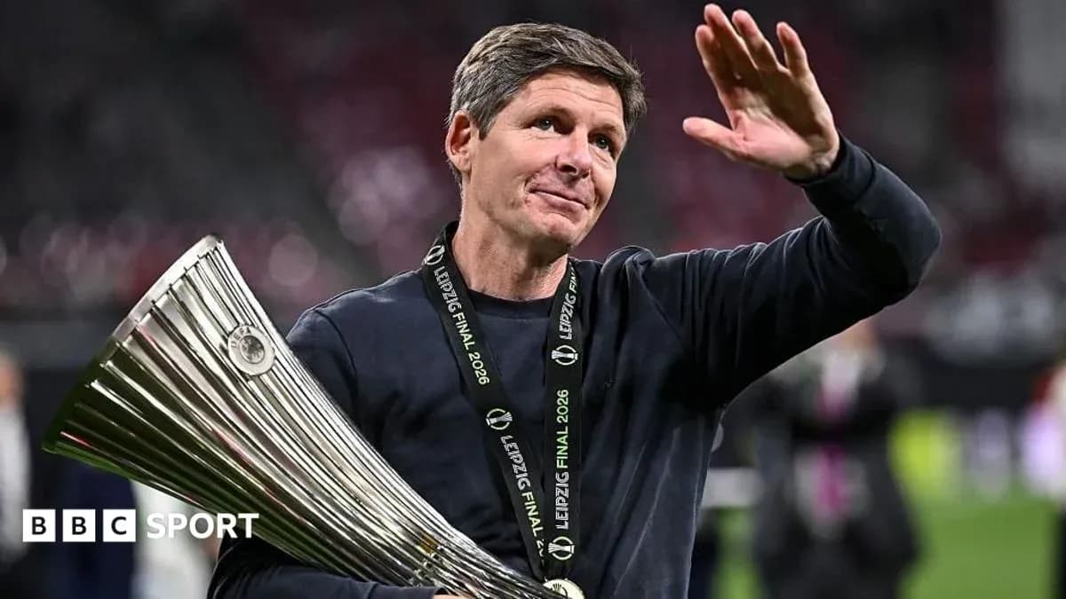 Coach celebrating with trophy after match victory