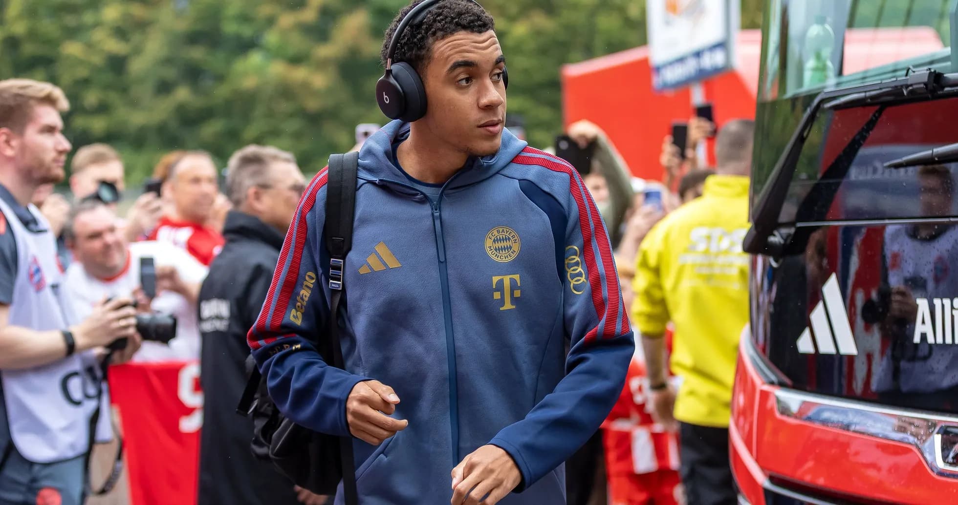 Player arriving at stadium with headphones on
