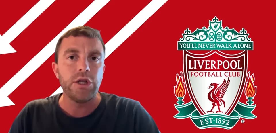 Presenter discussing Liverpool Football Club logo background