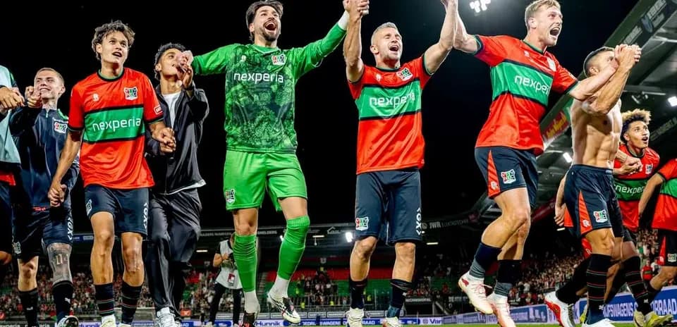 NEC Nijmegen players celebrating victory on the field