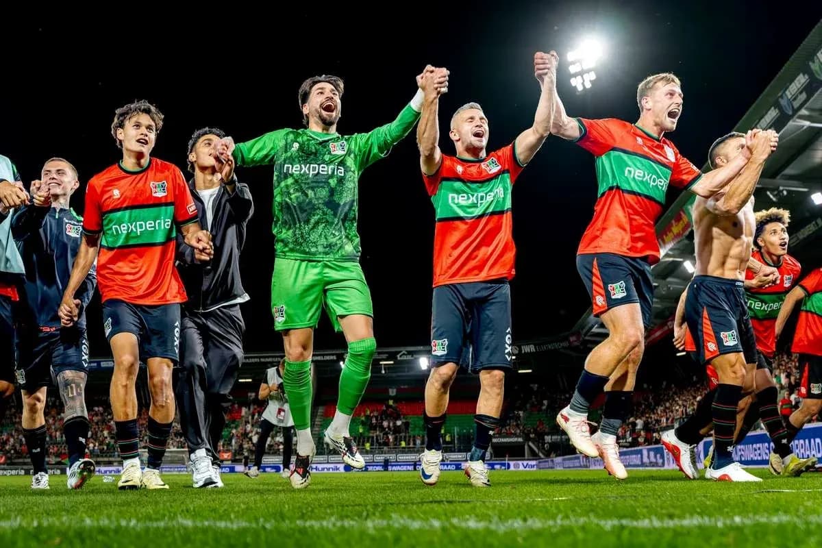 NEC Nijmegen players celebrating victory on the field