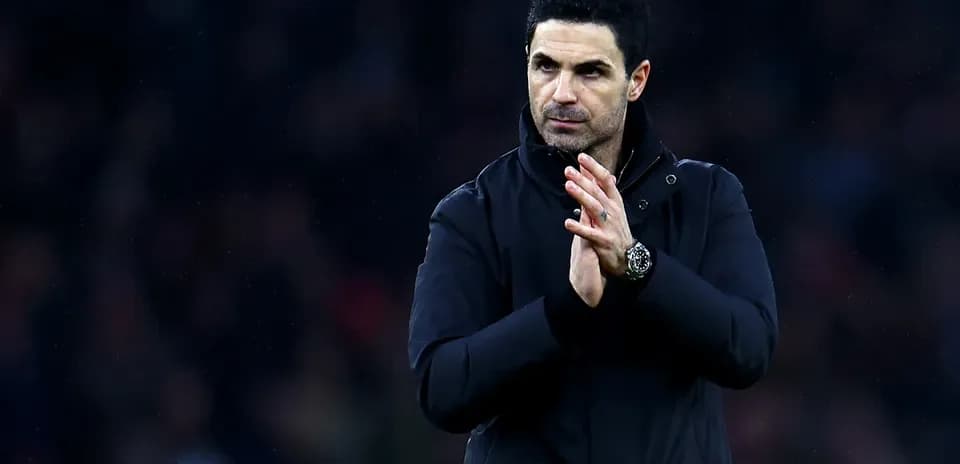 Manager clapping on the sidelines during match