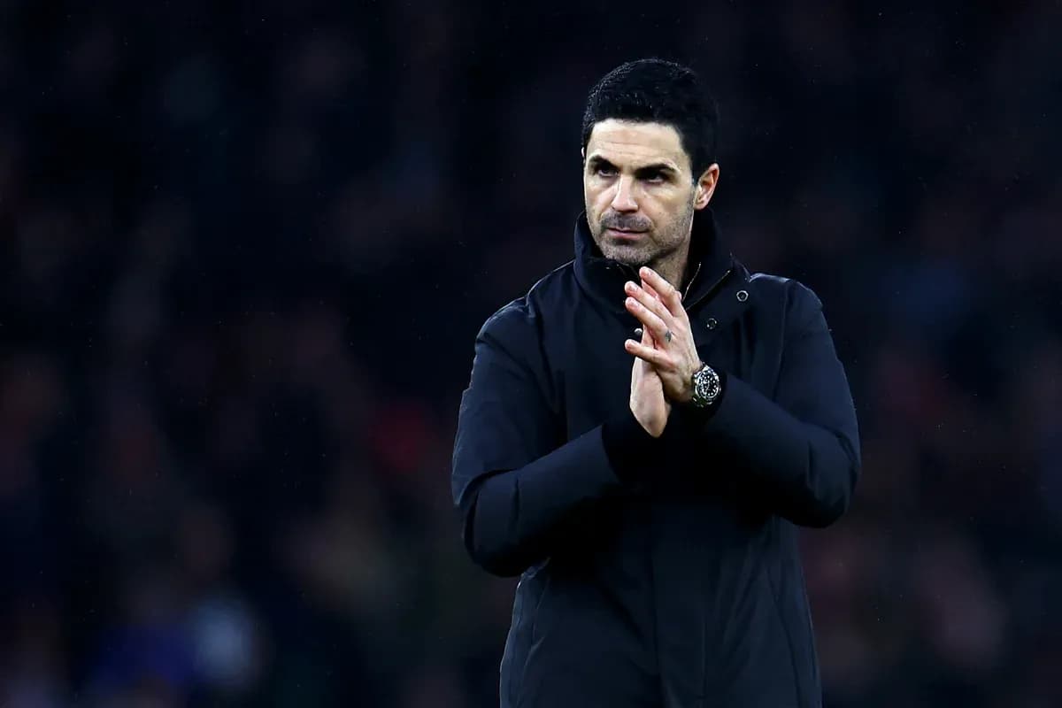 Manager clapping on the sidelines during match