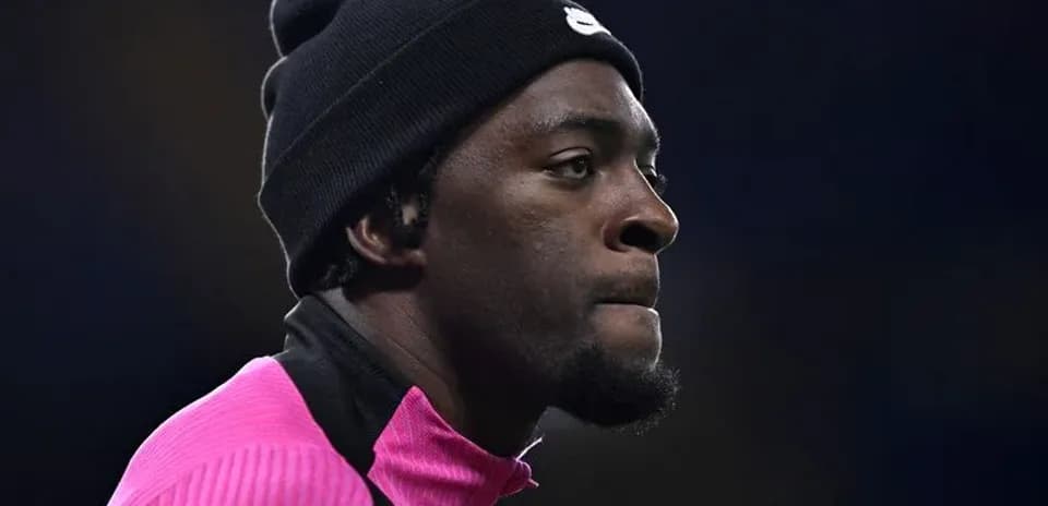 Player wearing a beanie during warm-up session