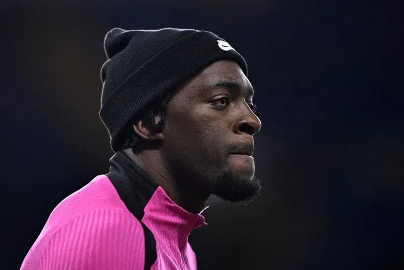 Player wearing a beanie during warm-up session
