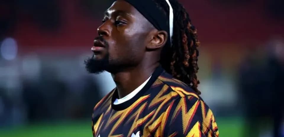 Player wearing patterned jersey during warm-up