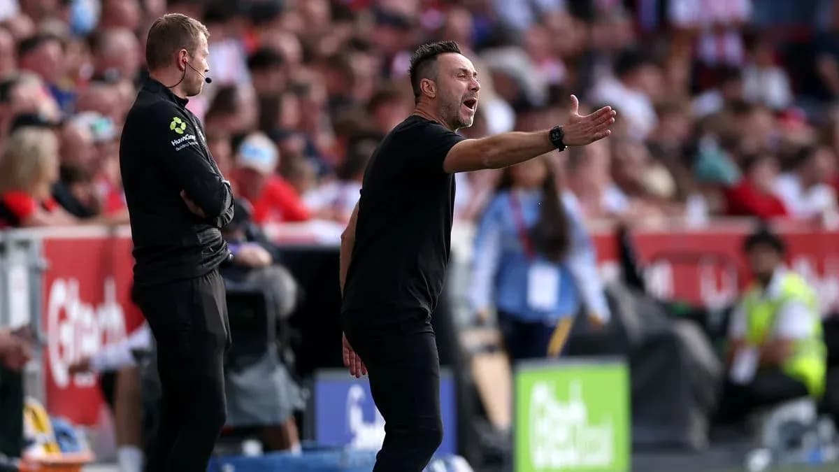 Coach gesturing during a match on the sidelines