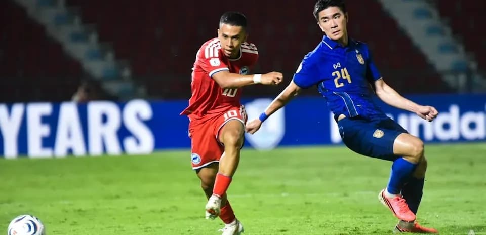 Player 10 dribbling past defender 24 during match