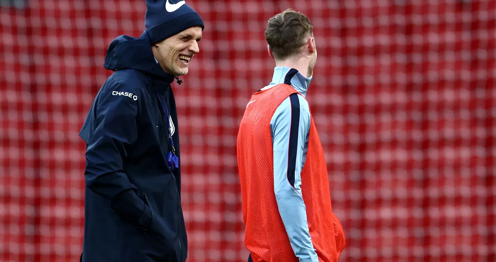 Coach and player talking during training session