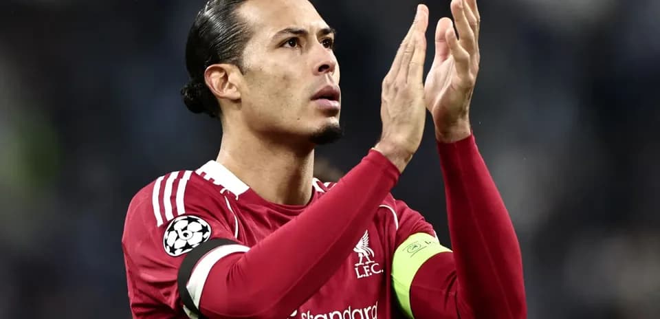 Player applauding fans in Liverpool FC kit