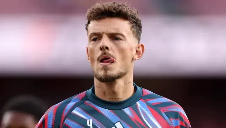 Goalkeeper in colorful jersey during match warm-up