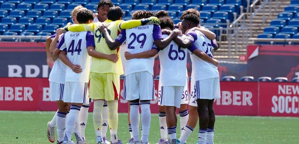 Orlando City II players in a team huddle