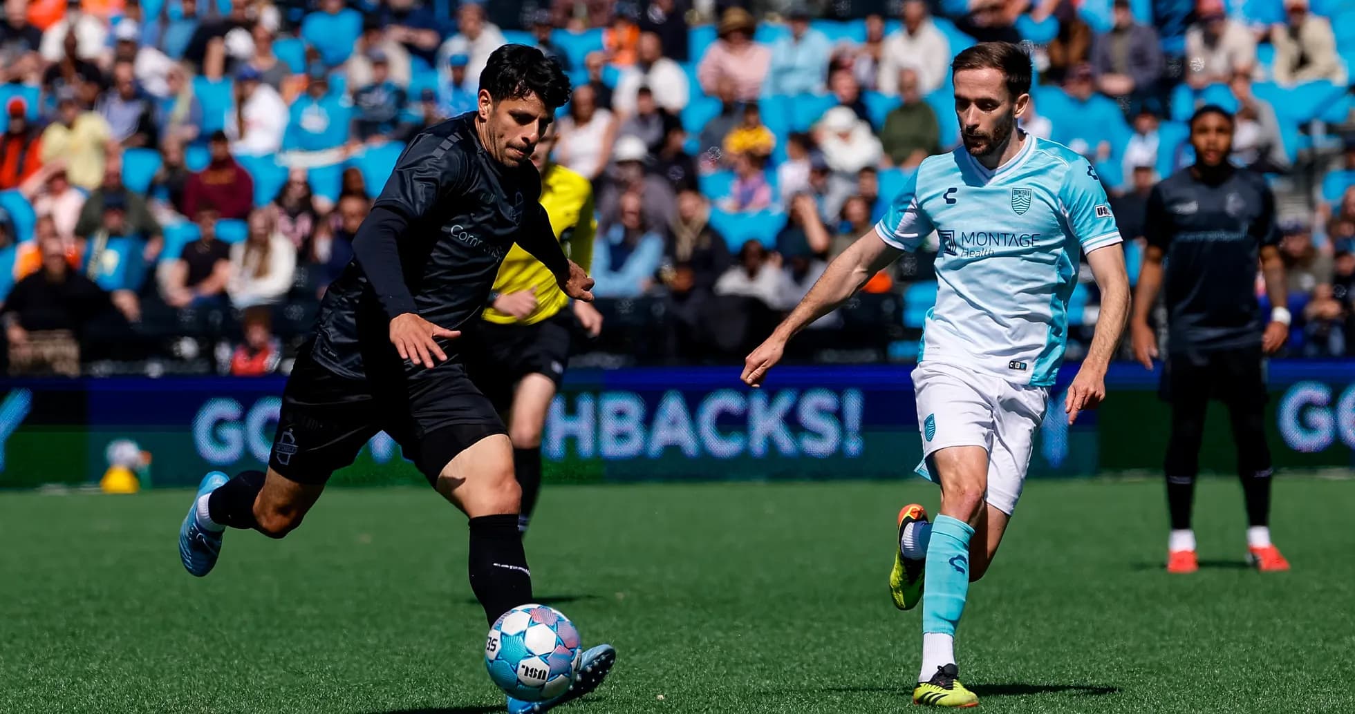 Monterey Bay player dribbling the ball against Loudoun United
