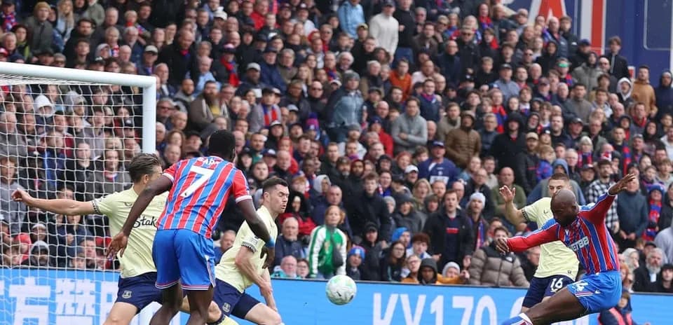Crystal Palace player shooting at goal against Everton