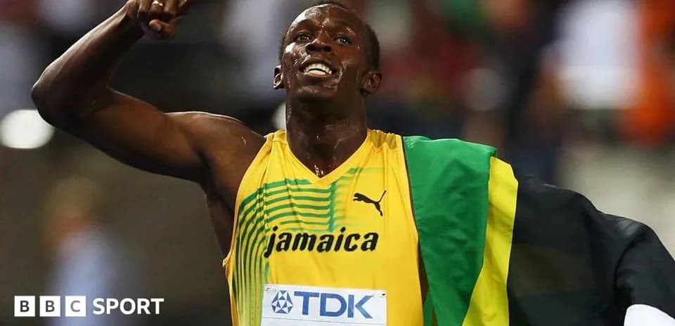 Athlete celebrating with Jamaican flag after race