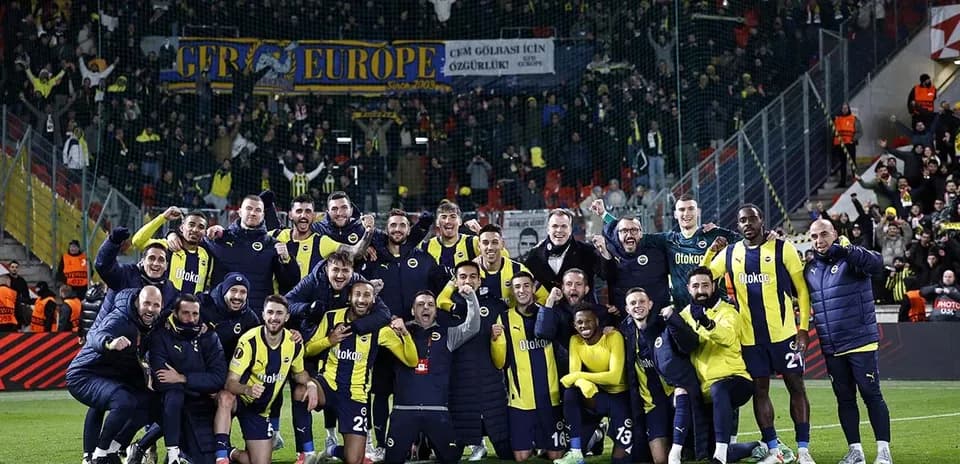 Fenerbahçe players celebrating with fans after match