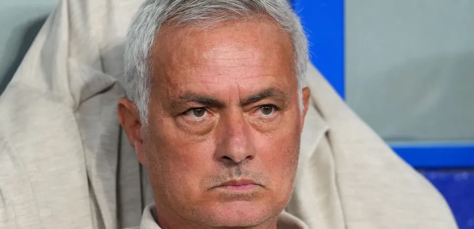 Coach sitting on the bench during a match