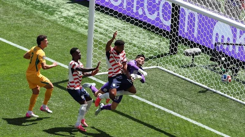 Players contesting a goal during a soccer match
