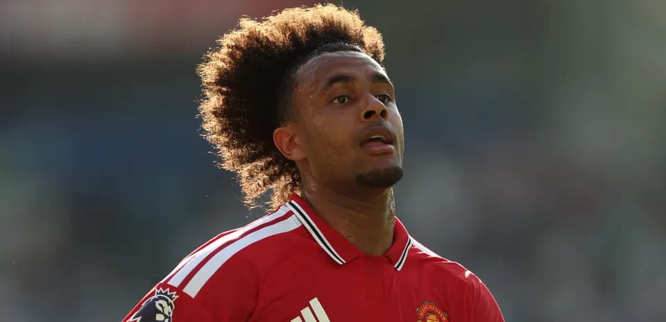 Player in Manchester United jersey on the pitch