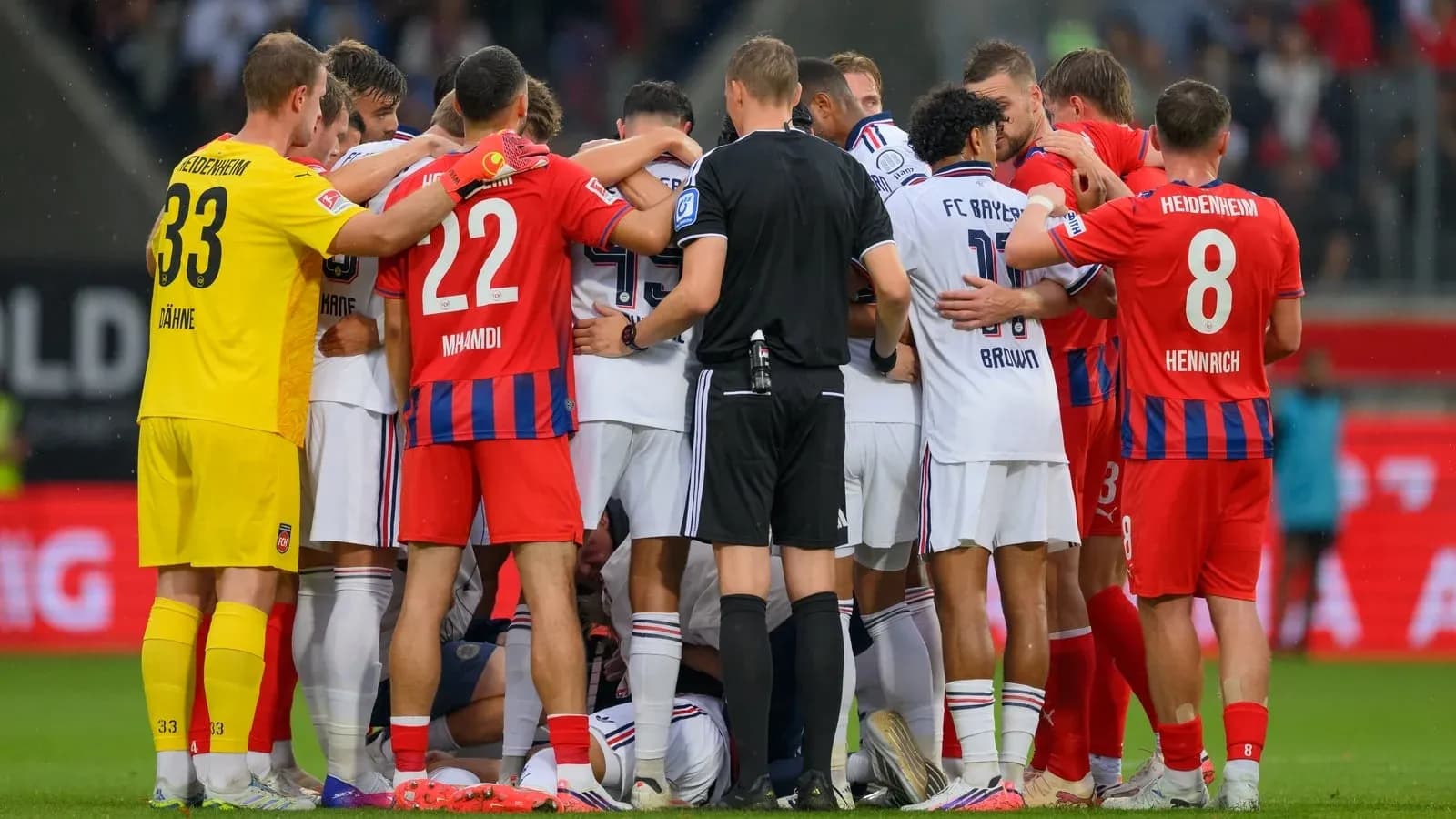 Players from both teams gathered during a stoppage