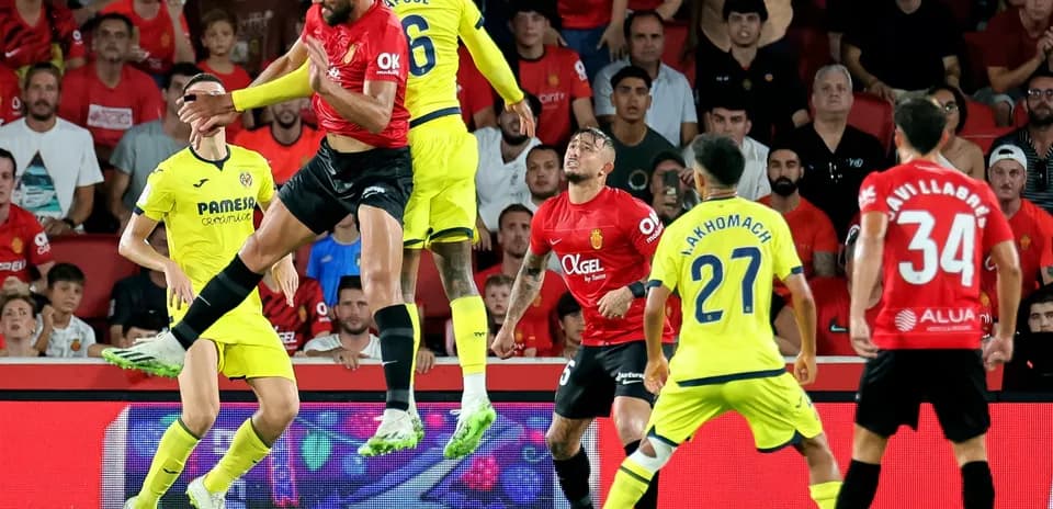 Players contesting for the ball during match