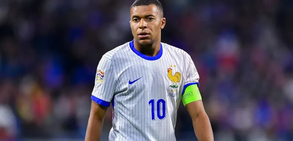 Kylian Mbappé wearing France jersey during match